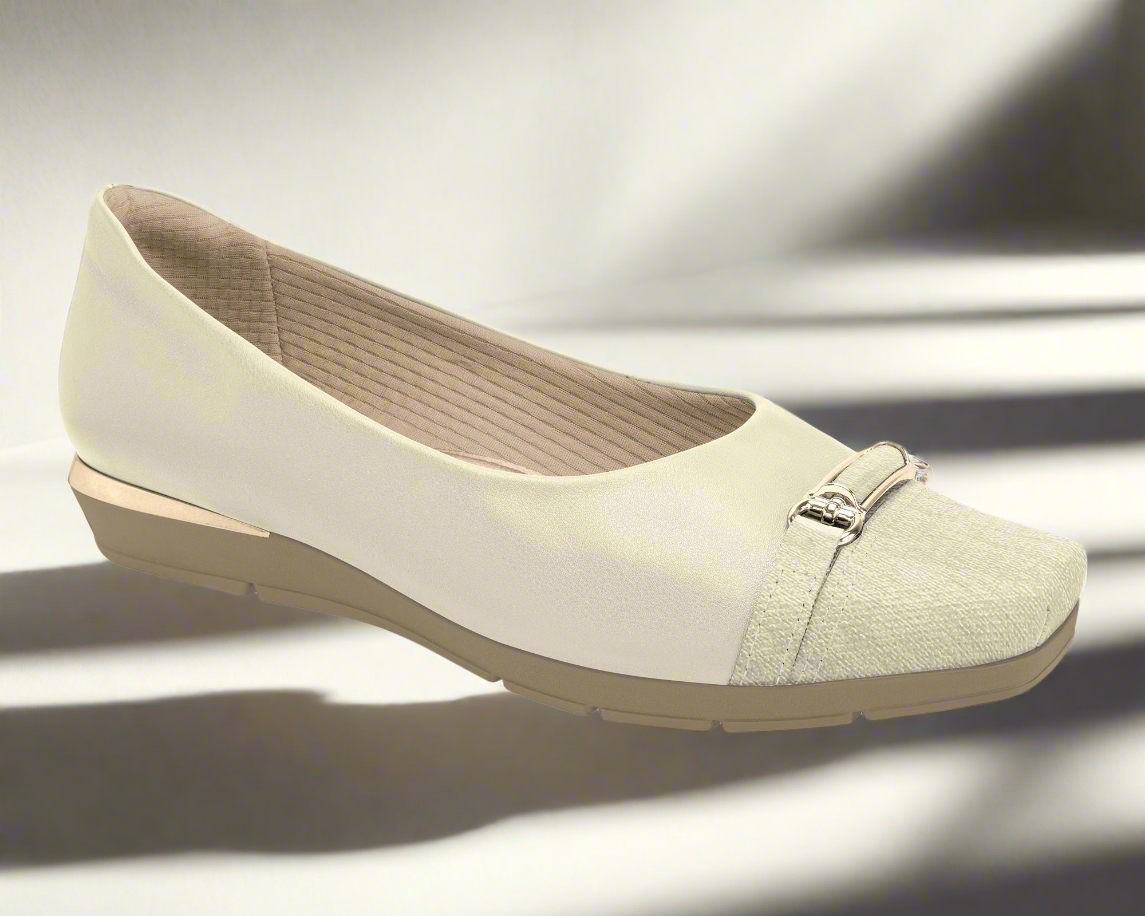 Experience pure comfort and elegance with the Piccadilly Therapy Business Wedge Shoes Ref: 147305-05 Off-White—cream-colored women's flats with a textured toe, metallic buckle detail, and low beige heel, perfect for effortless style at work.